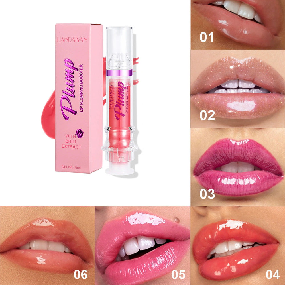 A tube of lip plumper next to a pair of salmon colored lips